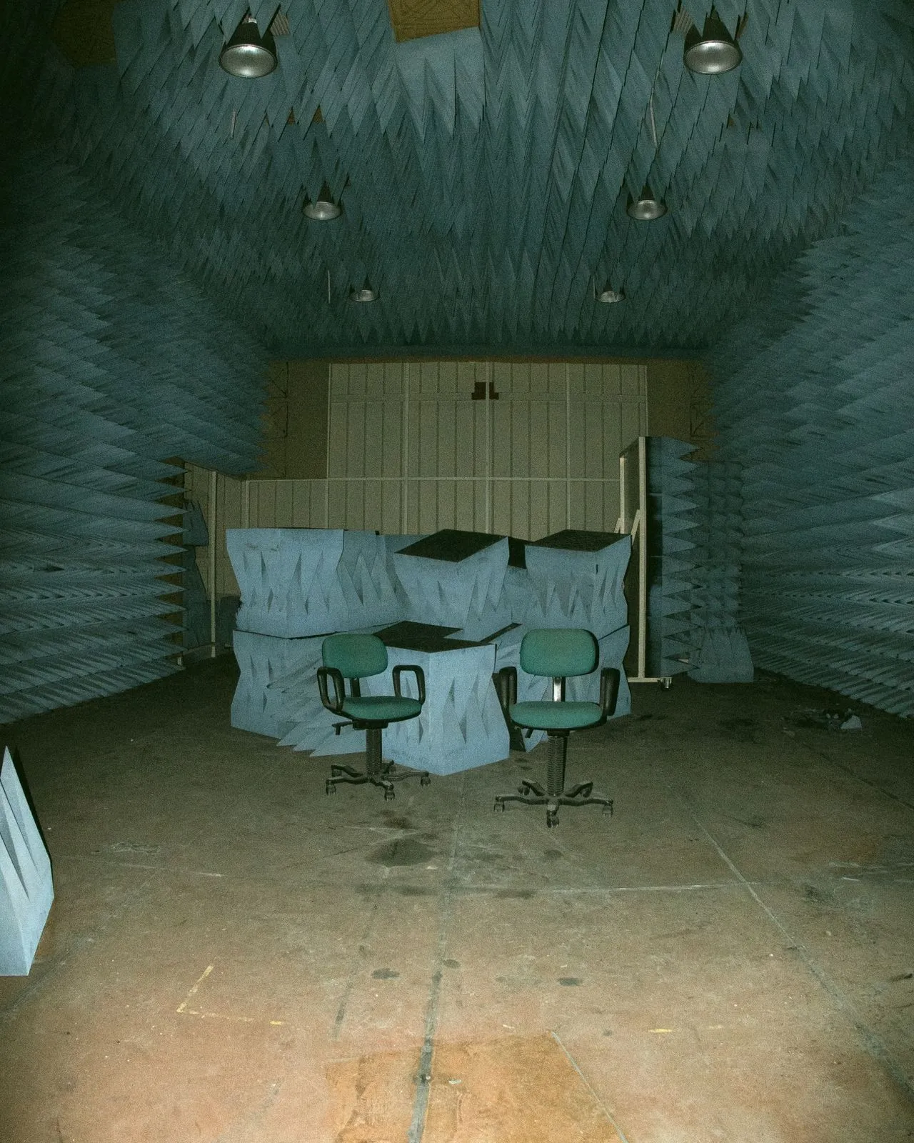 Contractor installing ceiling soundproofing insulation for improved acoustic performance